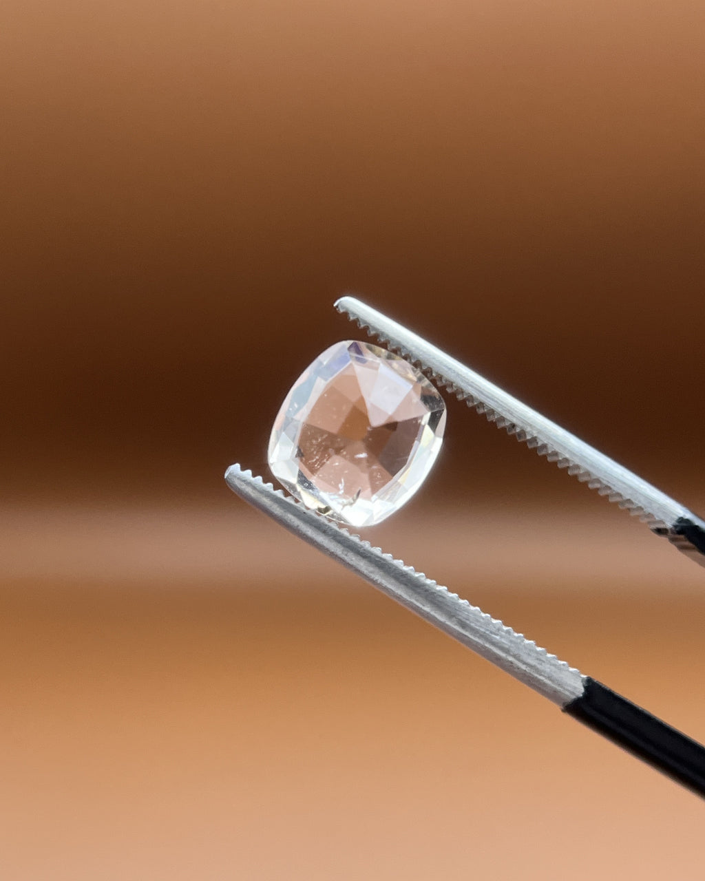 1.75ct Pakistan imperial topaz, cushion cut, bright peach-white glow
Natural imperial topaz, 1.75ct cushion cut, soft warm heart, held to the light