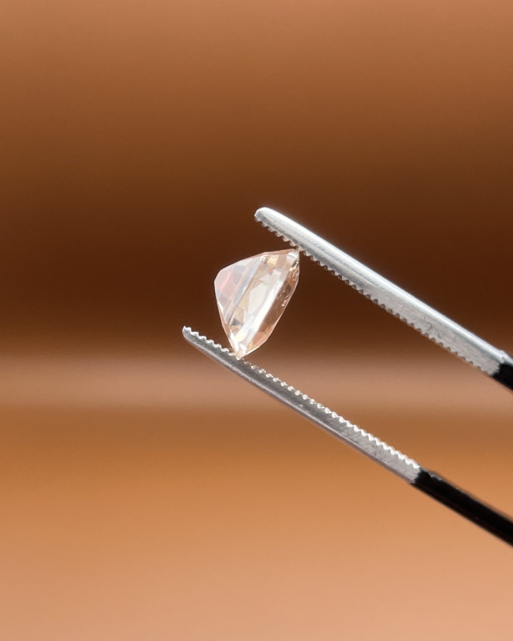 1.75ct Pakistan imperial topaz, cushion cut, bright peach-white glow
Natural imperial topaz, 1.75ct cushion cut, soft warm heart, held to the light