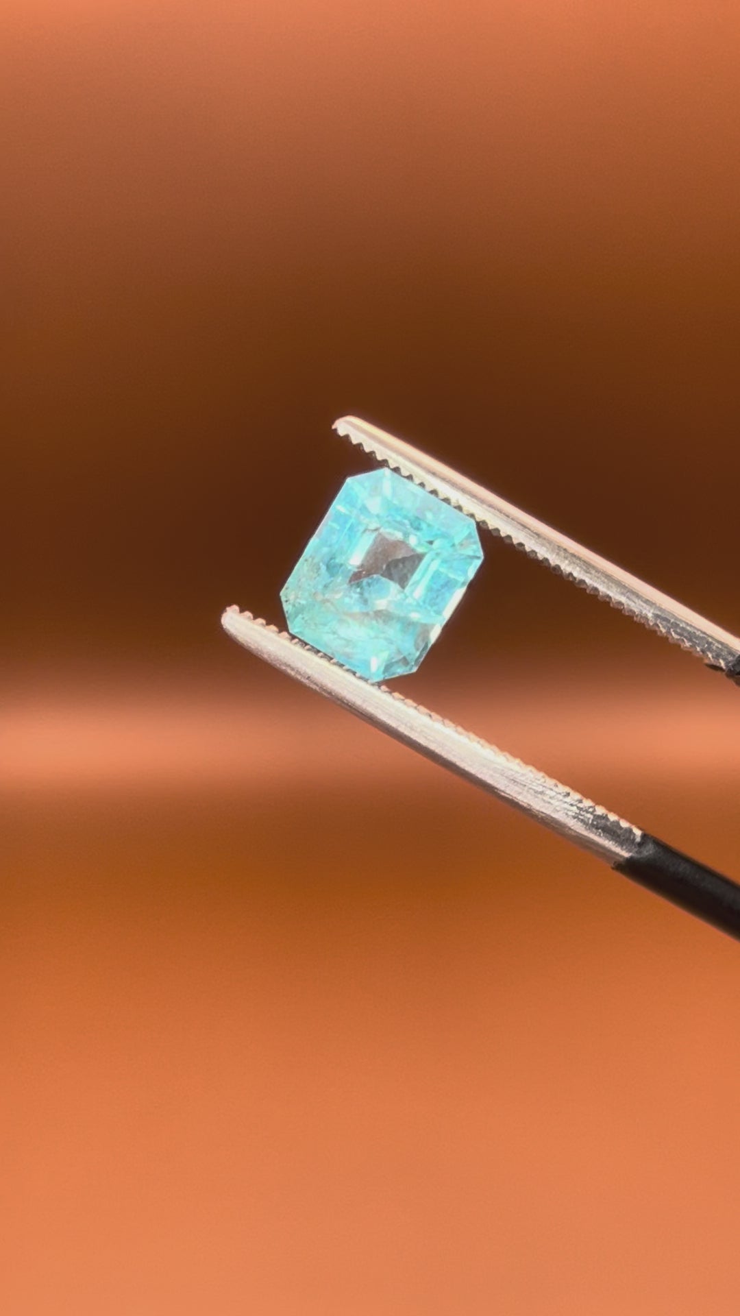 1.30ct Afghan indicolite tourmaline, pale blue emerald cut, step-cut facets
Natural light-blue indicolite tourmaline, 1.30ct emerald cut, held to the light