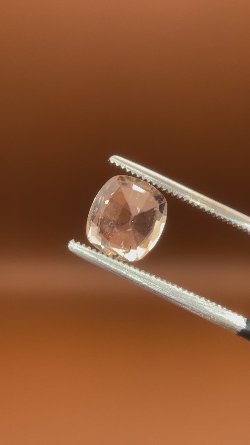 1.75ct Pakistan imperial topaz, cushion cut, bright peach-white glow
Natural imperial topaz, 1.75ct cushion cut, soft warm heart, held to the light