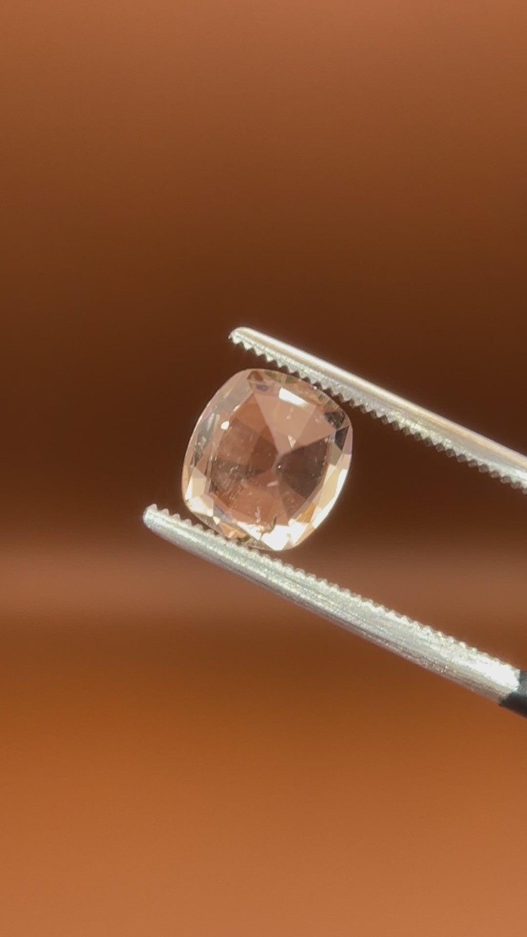 1.75ct Pakistan imperial topaz, cushion cut, bright peach-white glow
Natural imperial topaz, 1.75ct cushion cut, soft warm heart, held to the light
