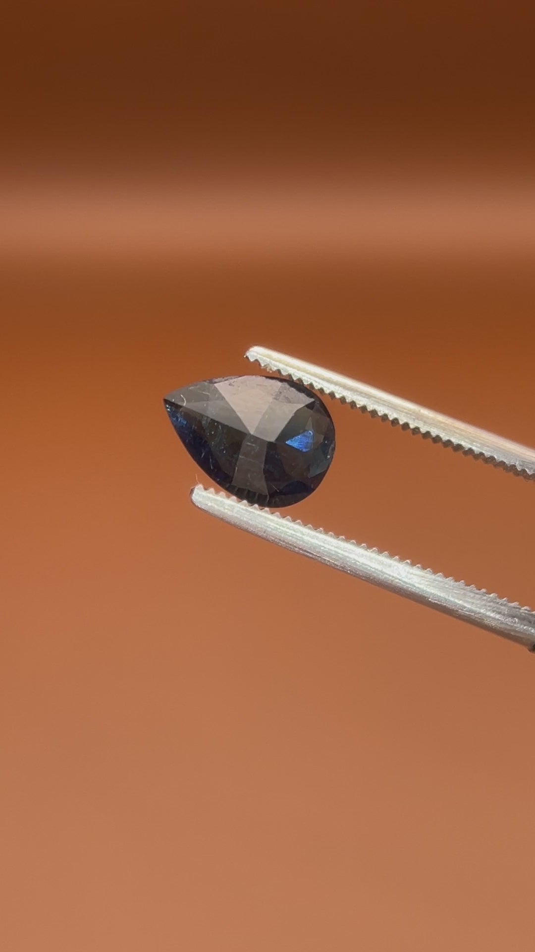 0.80ct Afghan indicolite tourmaline, inky blue-black pear cut, natural markings
Natural midnight-blue indicolite tourmaline, 0.80ct pear cut, held to the light