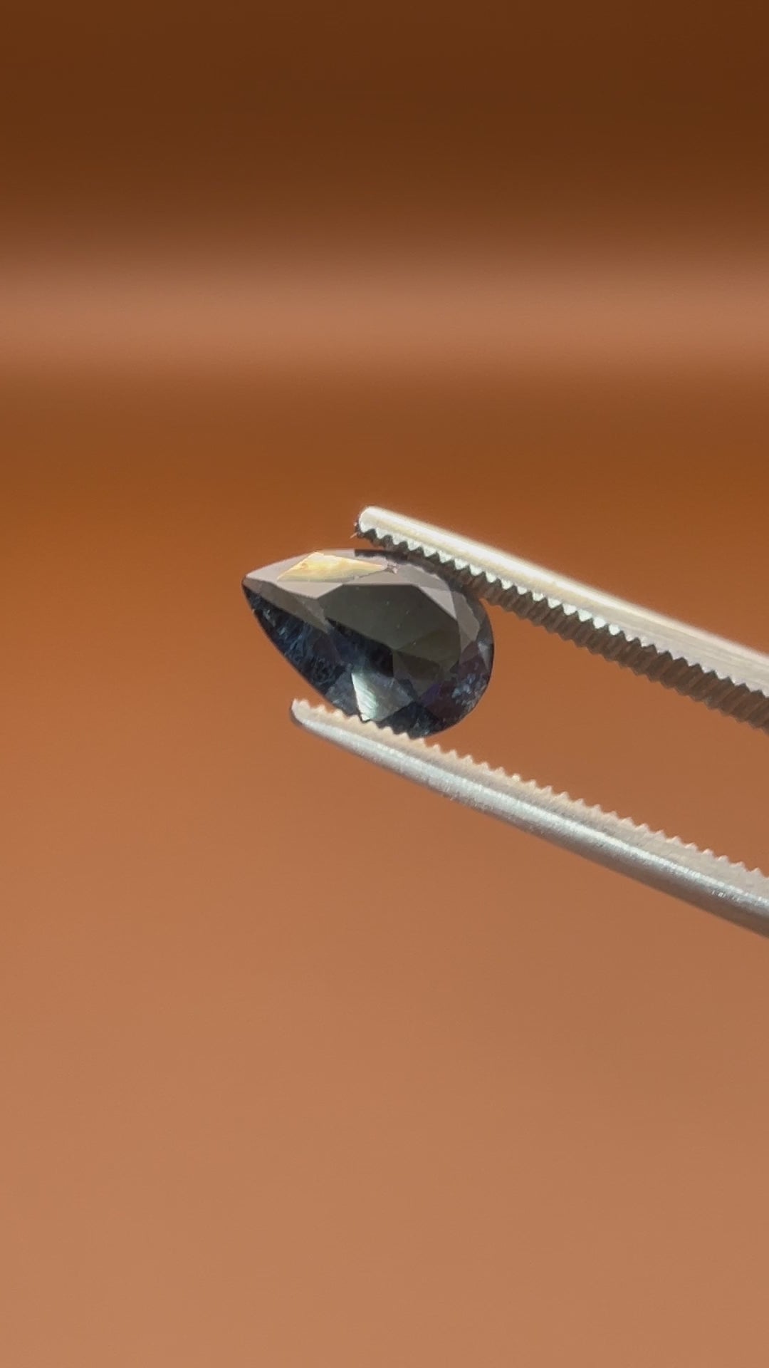 0.80ct Afghan indicolite tourmaline, inky blue-black pear cut, natural markings
Natural midnight-blue indicolite tourmaline, 0.80ct pear cut, held to the light