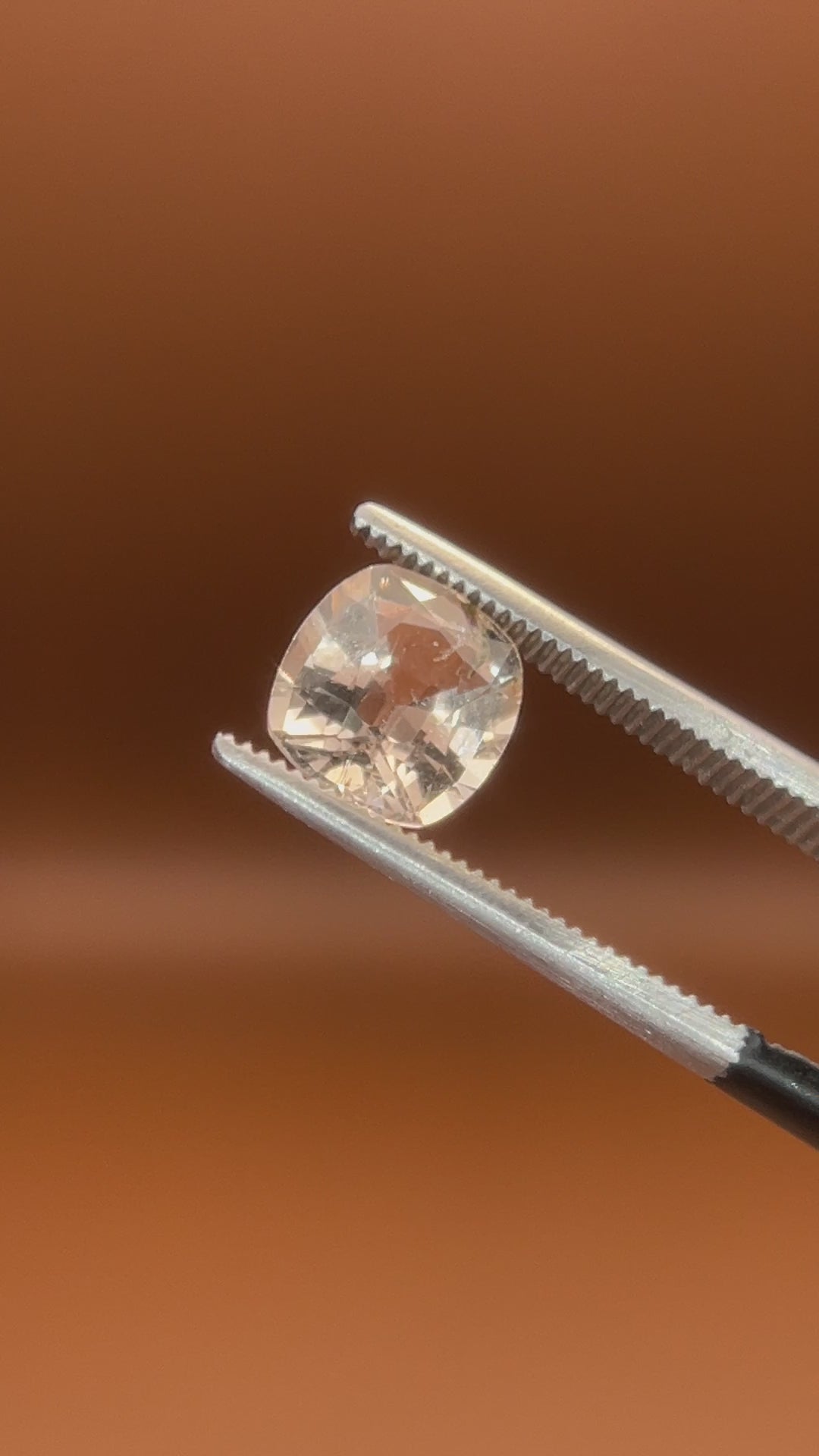 1.75ct Pakistan imperial topaz, cushion cut, bright peach-white glow
Natural imperial topaz, 1.75ct cushion cut, soft warm heart, held to the light